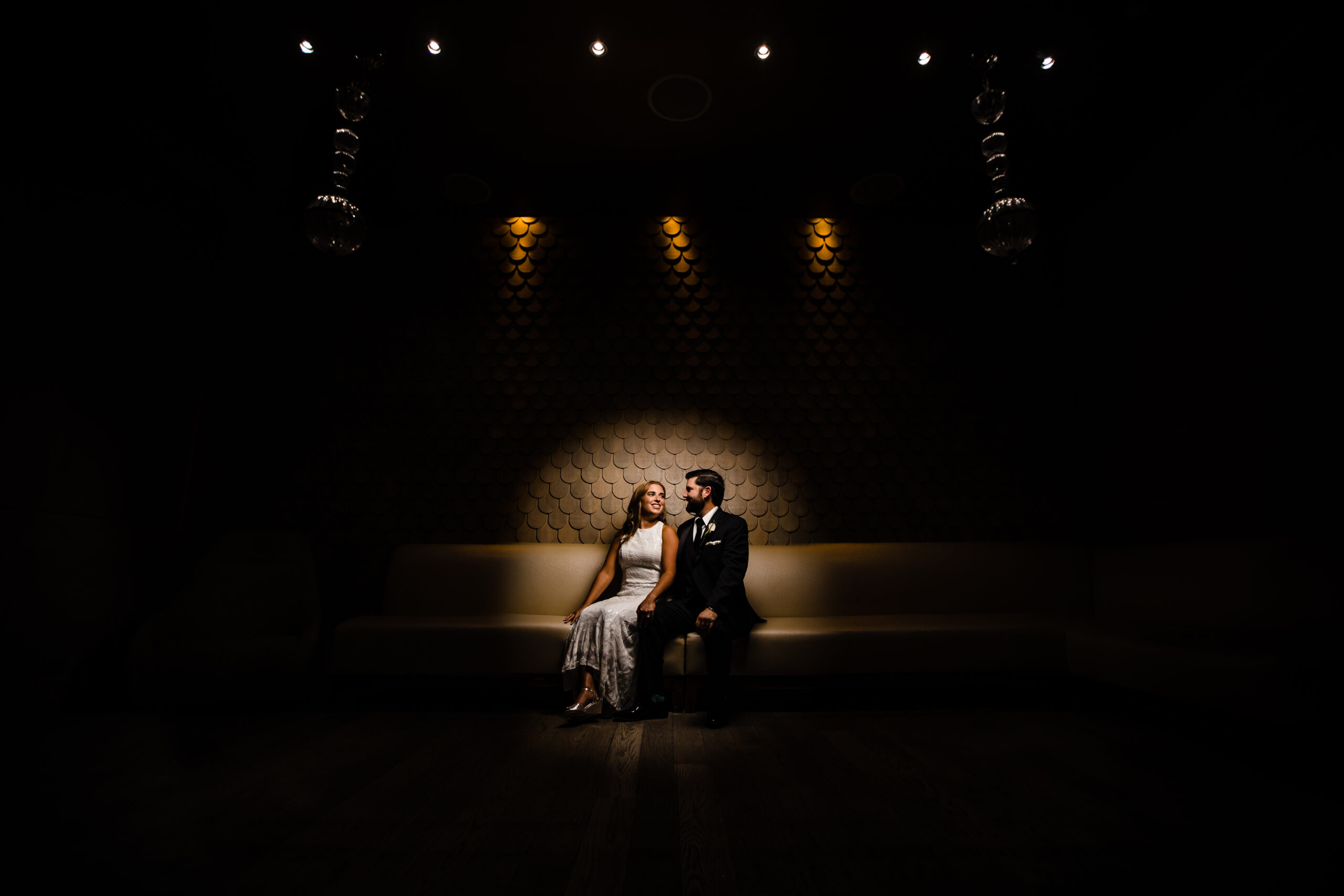 A beautifully composed and romantic portrait of a couple gazing lovingly into each other's eyes in the elegant lobby of Nomo Soho hotel in New York City during their wedding day portraits. This captivating moment was artfully captured by North Jersey wedding photographer Jarot Bocanegra