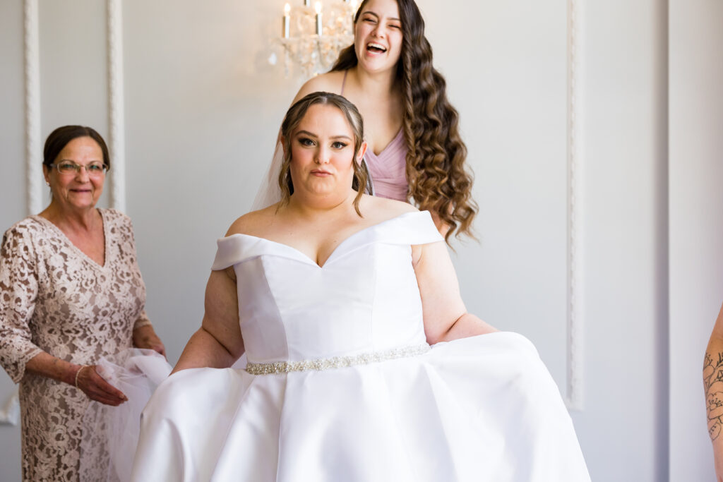 A bride is getting ready with her bridesmaids, captured by New Jersey Wedding Photographer Jarot Bocanegra.