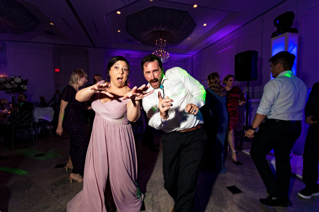A man and woman dancing at a wedding reception, captured by New Jersey Wedding Photographer Jarot Bocanegra.