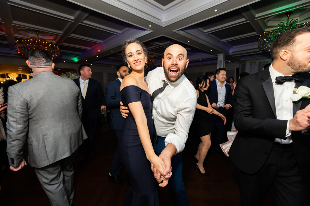 A man and woman dancing at a wedding reception, captured by New Jersey Wedding Photographer Jarot Bocanegra.
