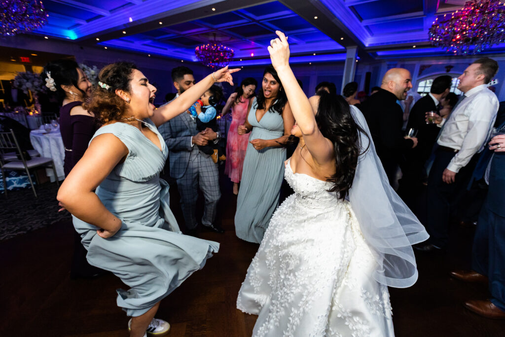 A bride and groom captured by New Jersey Wedding Photographer Jarot Bocanegra dancing at a wedding reception.