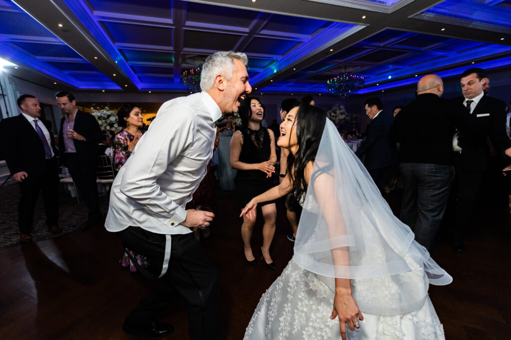 A bride and groom dancing at a wedding reception, captured by New Jersey Wedding Photographer Jarot Bocanegra.