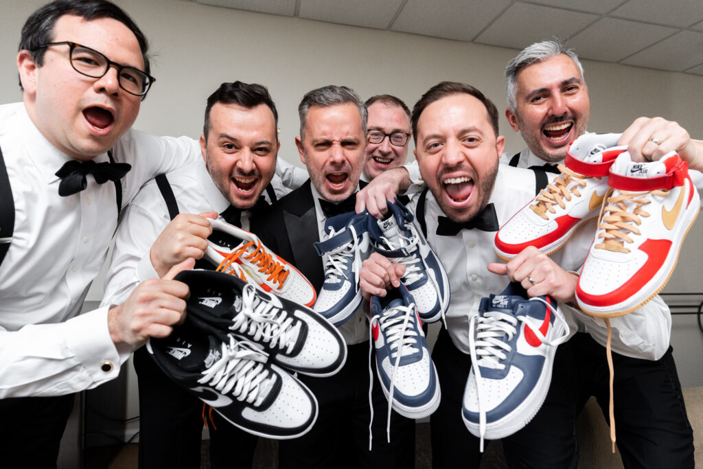 A group of men captured by New Jersey Wedding Photographer Jarot Bocanegra, posing with their shoes.