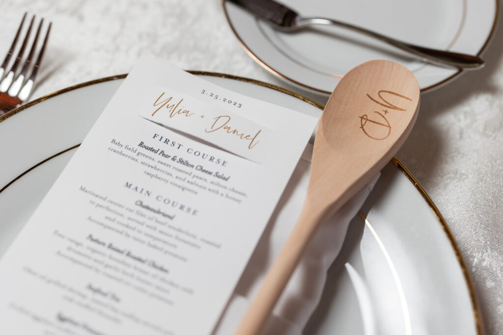 A table setting embellished with a wooden spoon, expertly captured by New Jersey Wedding Photographer Jarot Bocanegra.