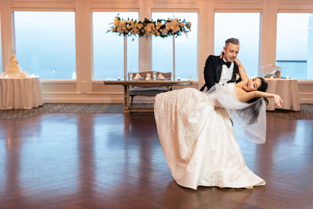 A bride and groom captured by New Jersey Wedding Photographer Jarot Bocanegra dancing on the dance floor.