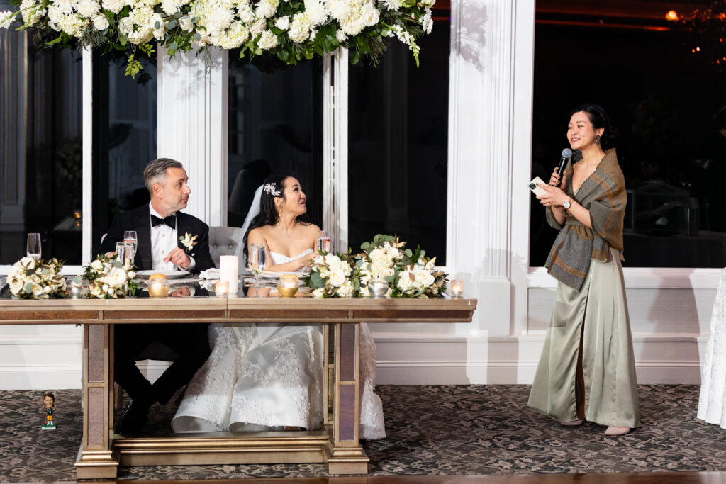 A bride and groom captured by New Jersey Wedding Photographer Jarot Bocanegra sharing a toast at their wedding reception.