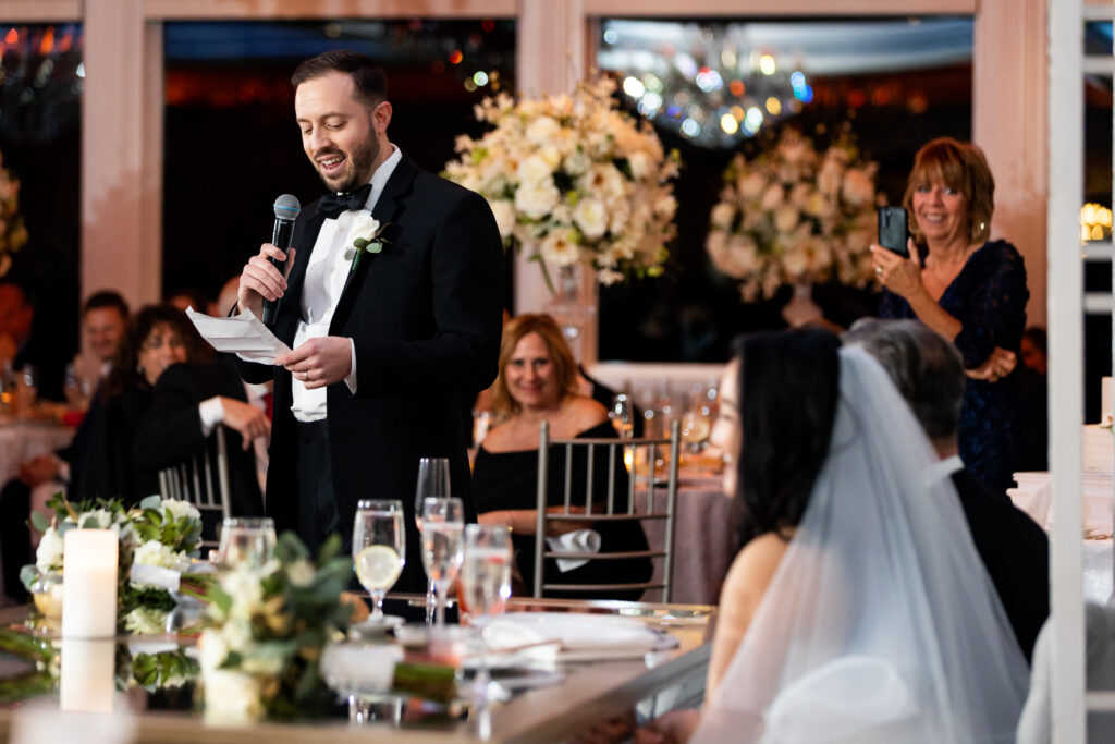 A groom giving a heartfelt speech at his wedding reception, captured by New Jersey Wedding Photographer Jarot Bocanegra.