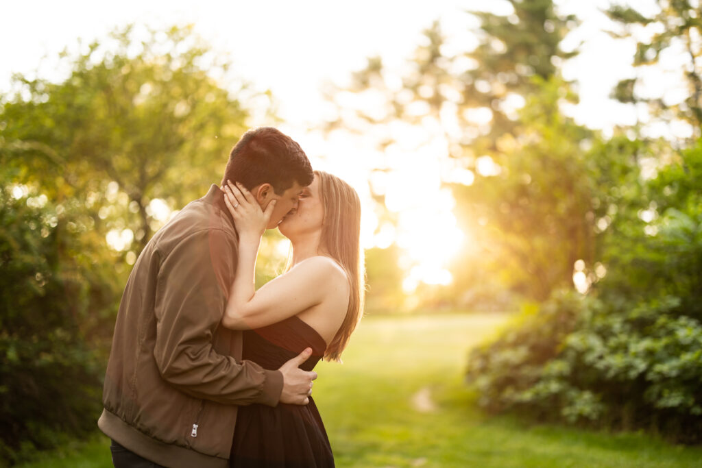 A couple kissing at New Jersey Botanical Garden at sunset, captured by New Jersey Wedding Photographer Jarot Bocanegra.