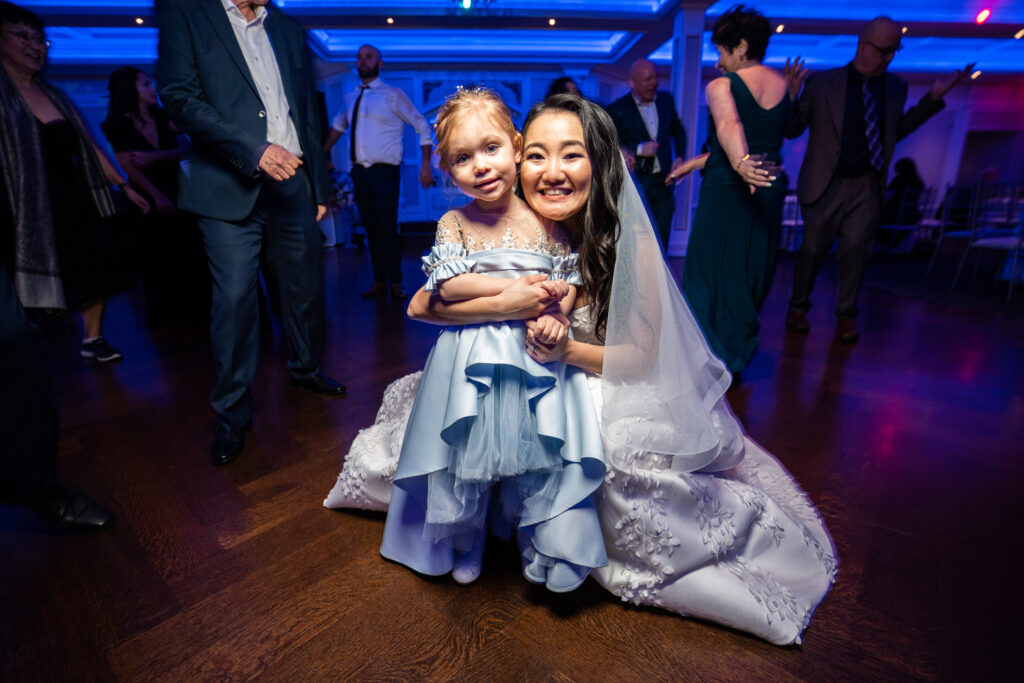 A bride and her daughter on the dance floor at a wedding, captured by New Jersey Wedding Photographer Jarot Bocanegra.