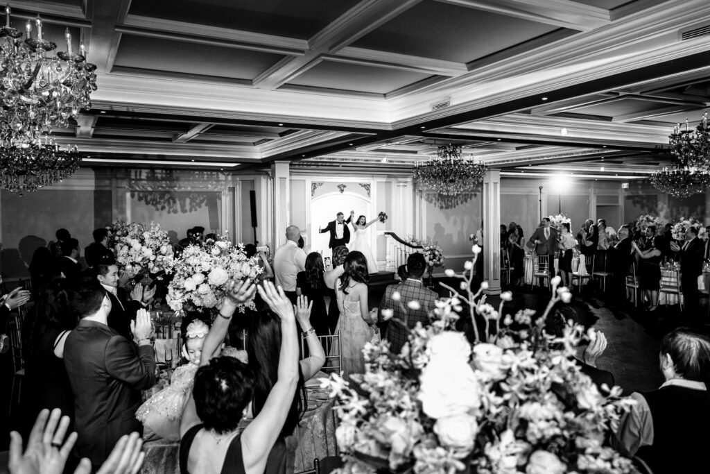 A black and white photo of a wedding reception, captured by New Jersey Wedding Photographer Jarot Bocanegra.