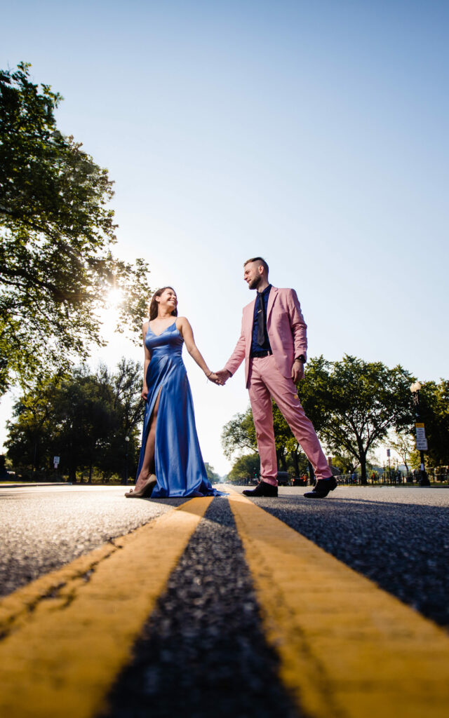 A couple, captured by New Jersey Wedding Photographer Jarot Bocanegra, standing in the middle of a road.